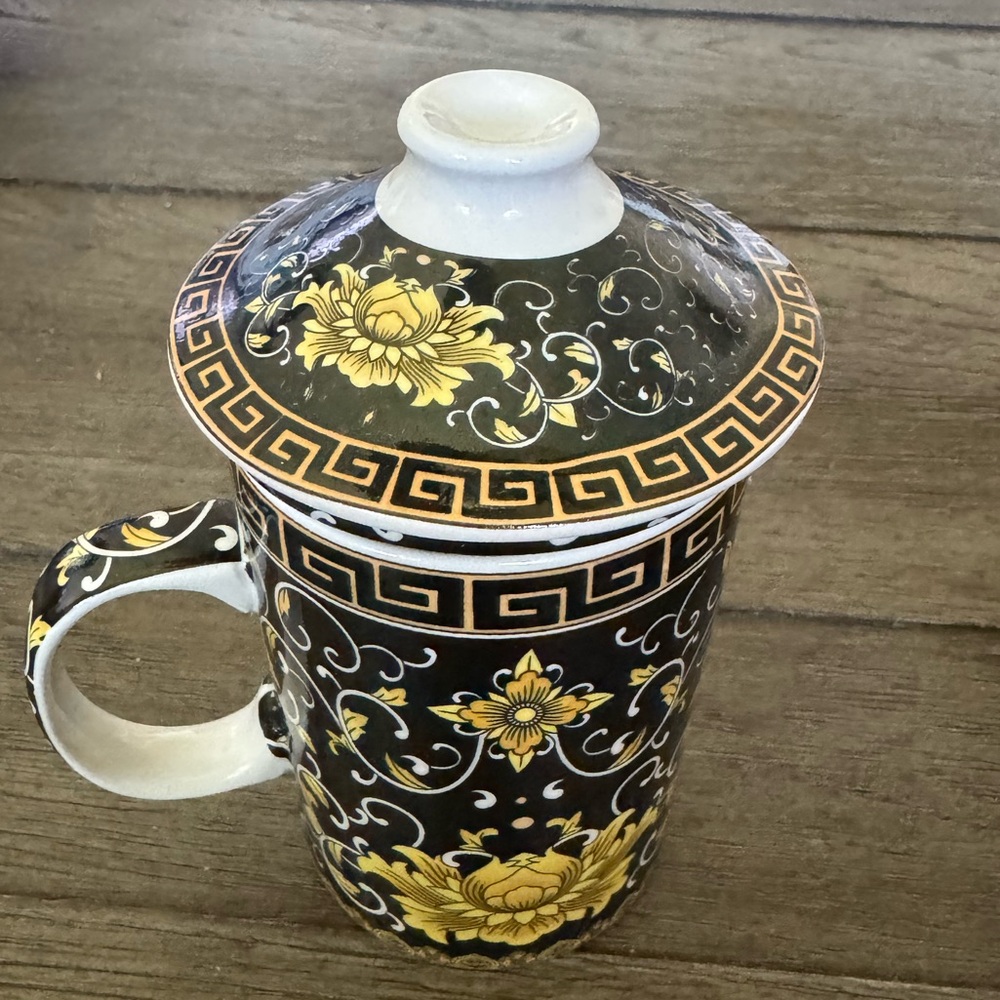 Porcelain 3 piece tea cup.  Cup, lid and strainer.